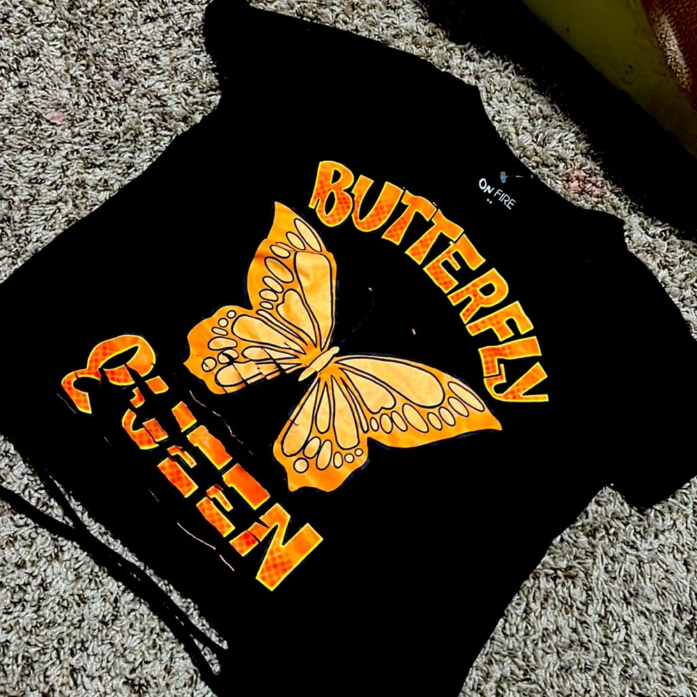 A cute butterfly shirt never worn